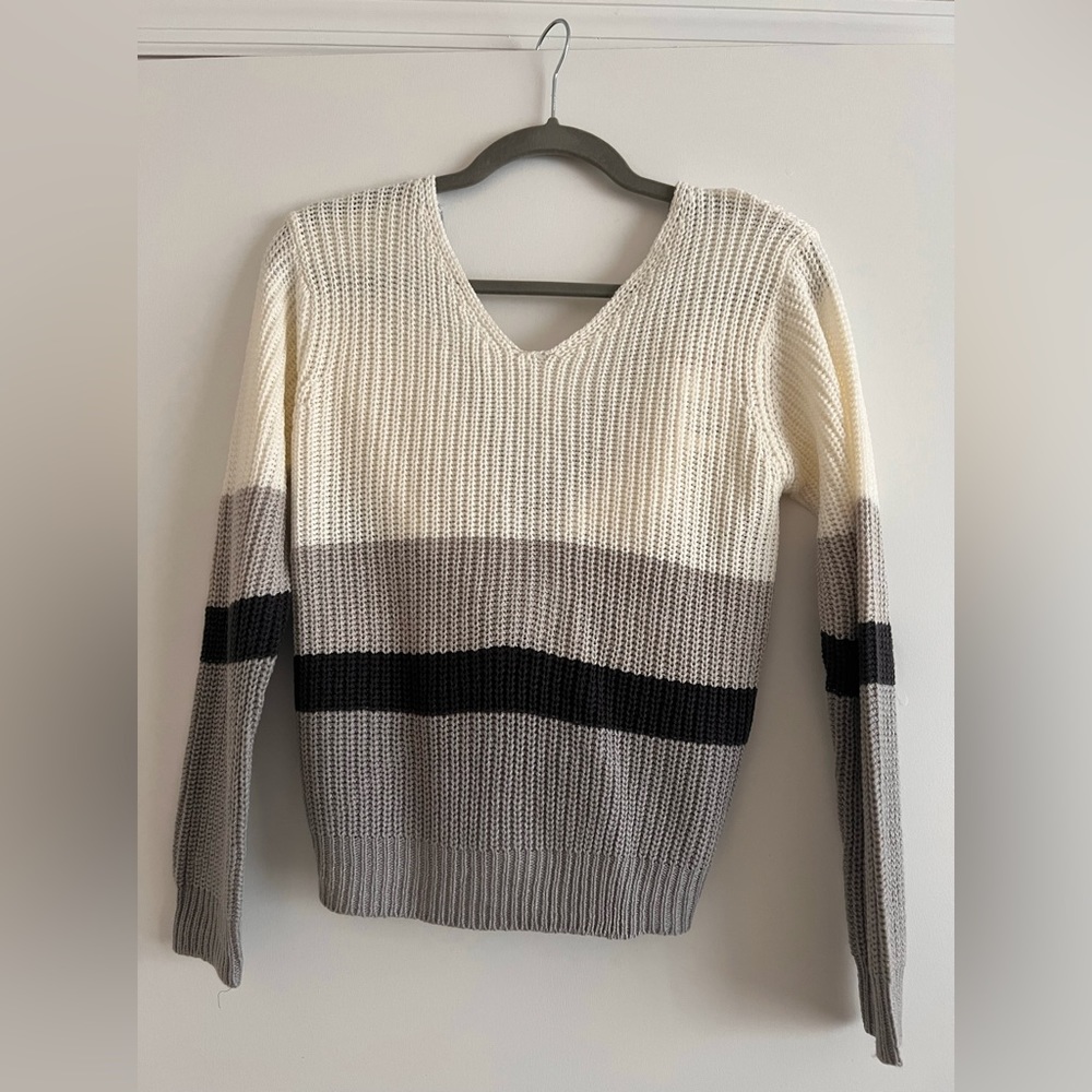 Striped sweater. Not oversized. Longer style of cropped.